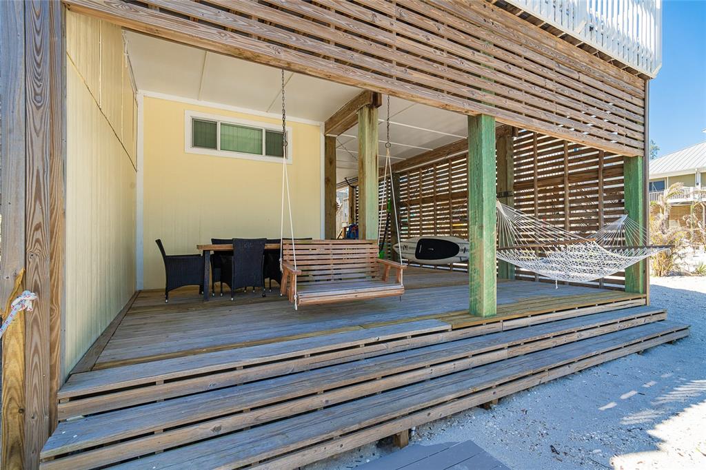 360 South Gulf Boulevard Boca Grande, FL 33921 - Photo 35 of 64 a view of backyard with wooden floor and a outdoor space