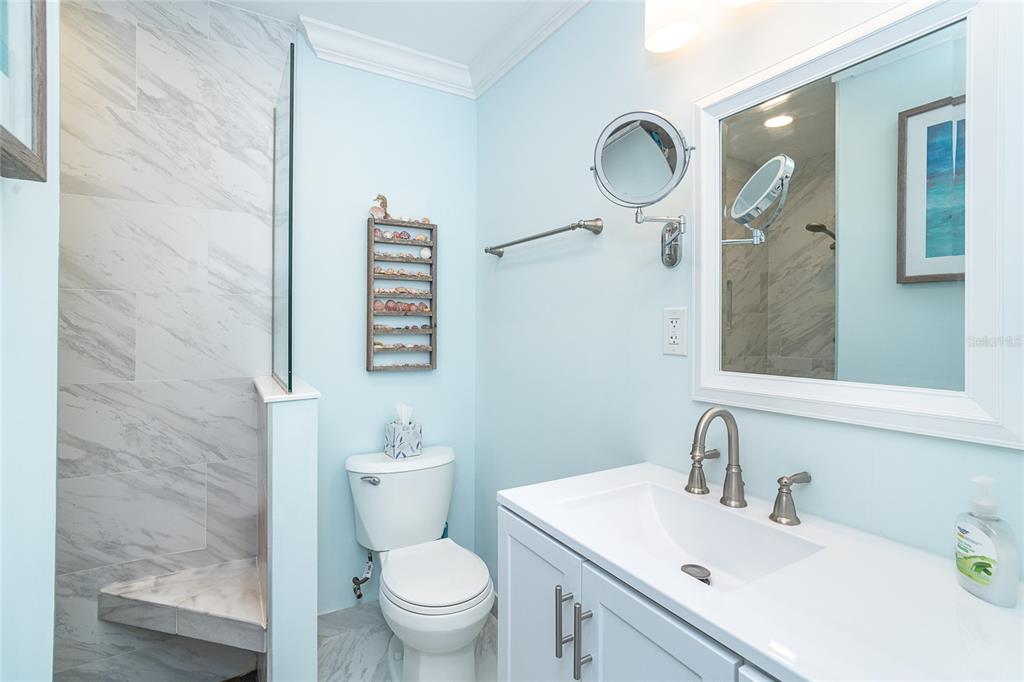 360 South Gulf Boulevard Boca Grande, FL 33921 - Photo 40 of 64 a bathroom with a sink vanity mirror and toilet