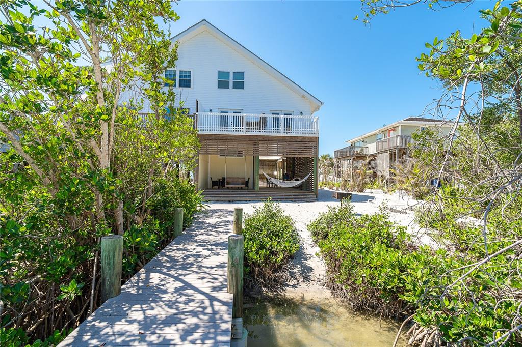 360 South Gulf Boulevard Boca Grande, FL 33921 - Photo 46 of 64 a front view of a house with a yard