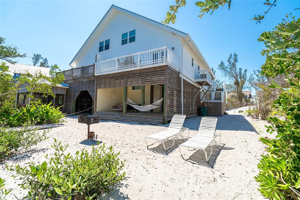 360 South Gulf Boulevard Boca Grande, FL 33921 - Photo 47 of 64 a view of a house with snow on the side of the road