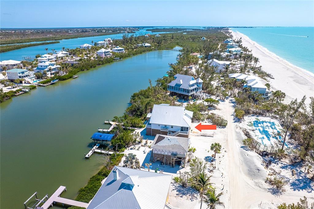 360 South Gulf Boulevard Boca Grande, FL 33921 - Photo 48 of 64 an aerial view of a house with a lake view