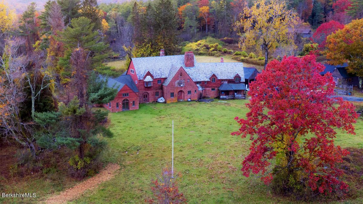 a aerial view of a house with a yard and garden