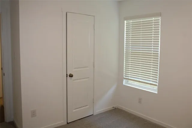 a view of a room that has a window in it