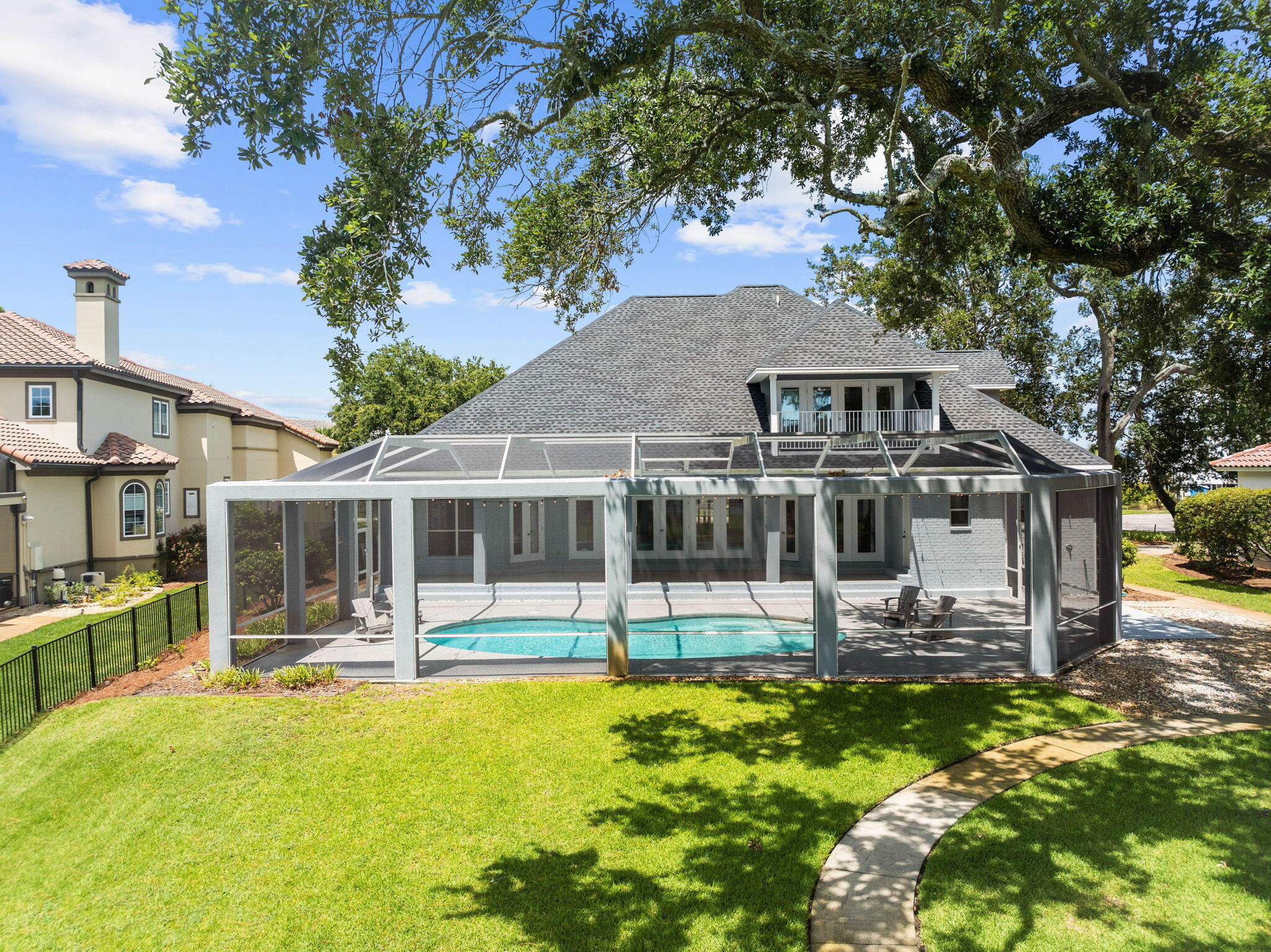 1780 Driftwood Point Road Santa Rosa Beach, FL 32459 - Photo 21 of 101 a front view of a house with a yard table and chairs