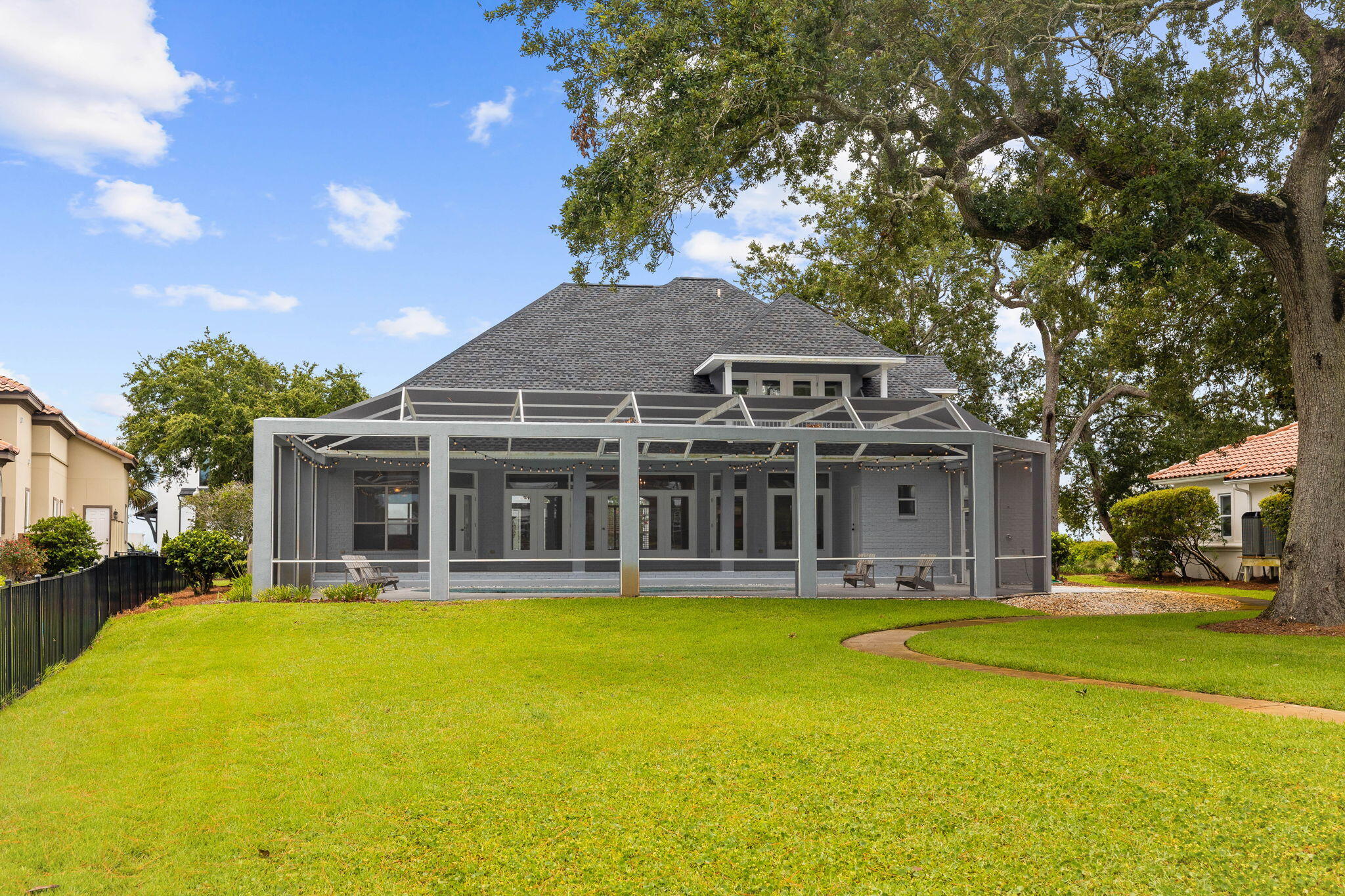 1780 Driftwood Point Road Santa Rosa Beach, FL 32459 - Photo 34 of 101 a front view of a house with swimming pool and porch with furniture