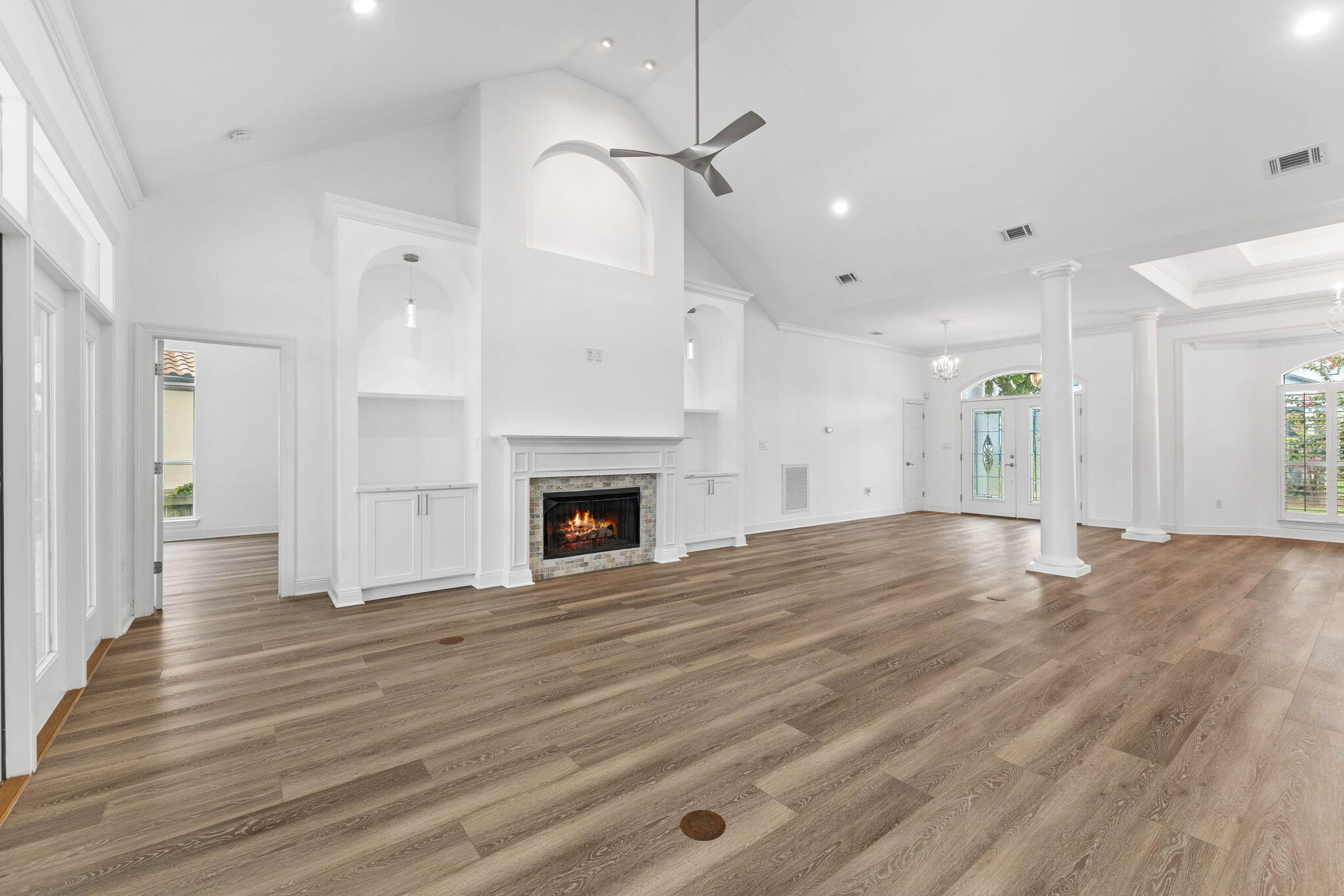 1780 Driftwood Point Road Santa Rosa Beach, FL 32459 - Photo 50 of 101 a view of empty room with wooden floor and fireplace