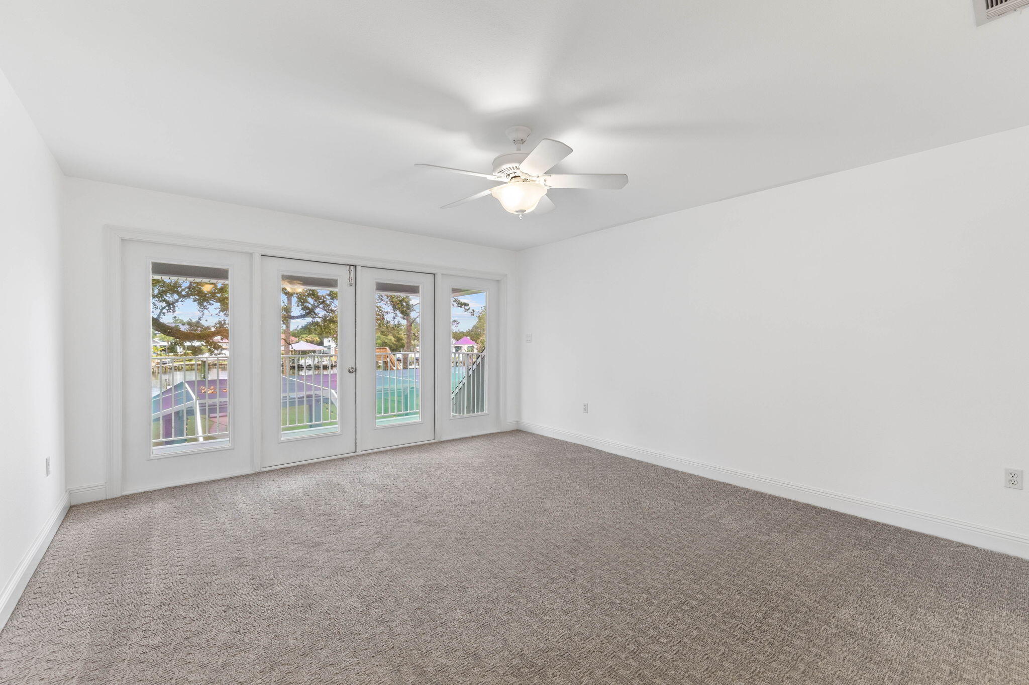1780 Driftwood Point Road Santa Rosa Beach, FL 32459 - Photo 67 of 101 an empty room with windows and fan