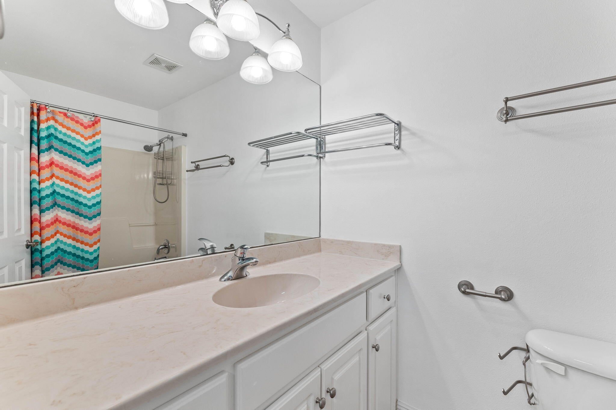 1780 Driftwood Point Road Santa Rosa Beach, FL 32459 - Photo 70 of 101 a bathroom with a sink a vanity and a mirror
