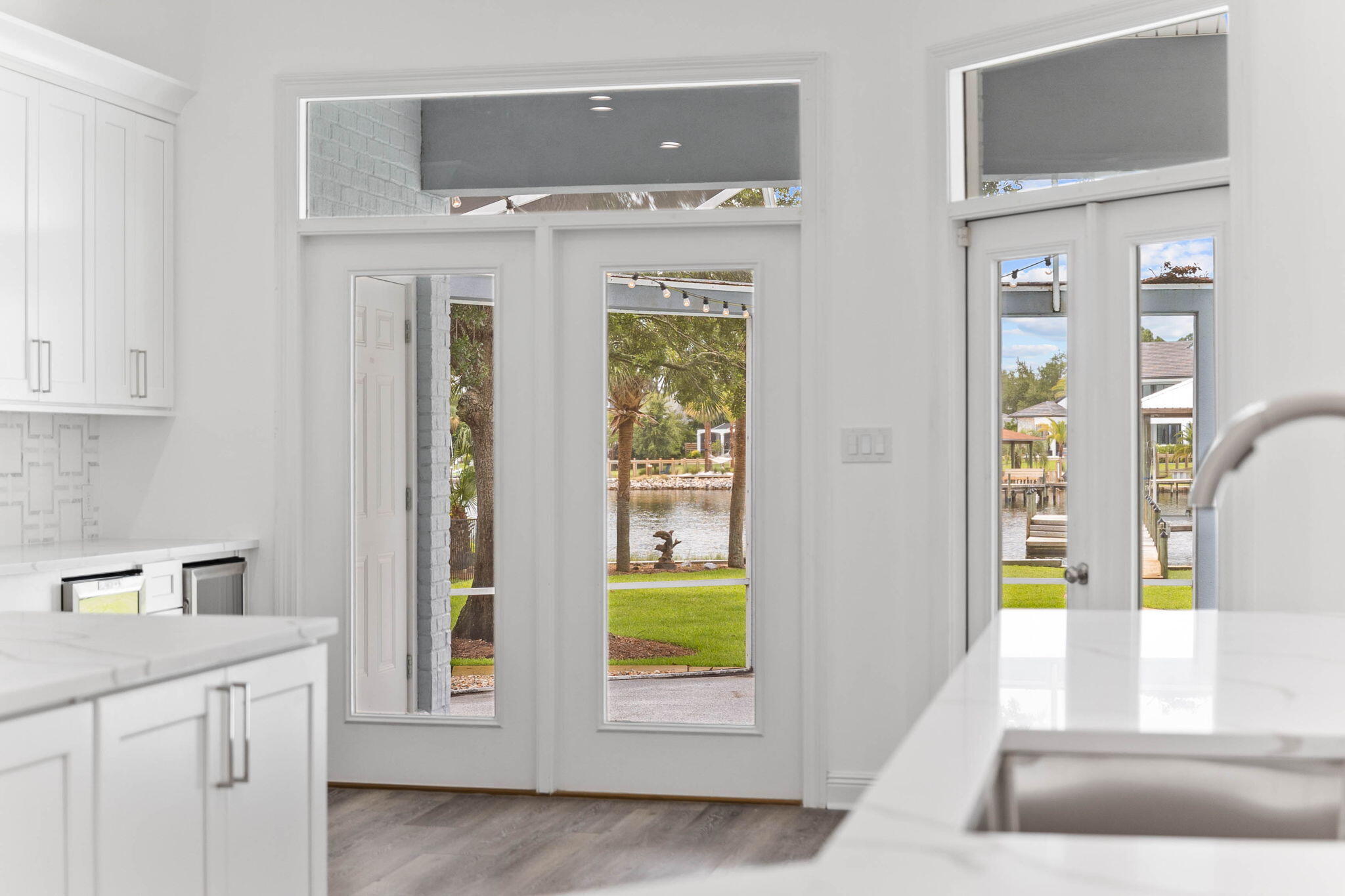 1780 Driftwood Point Road Santa Rosa Beach, FL 32459 - Photo 86 of 101 a view of an entryway with wooden floor and a fireplace