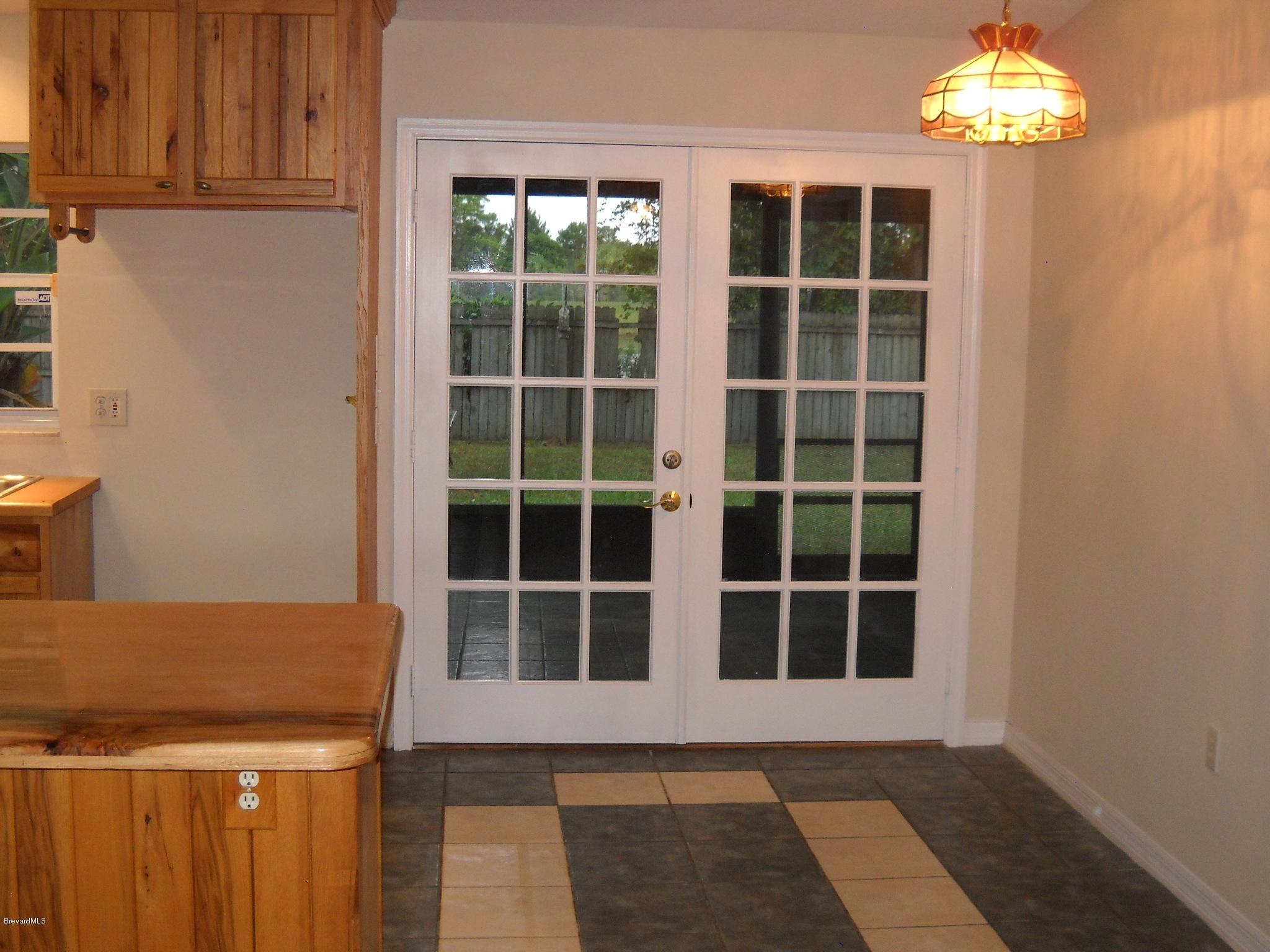 5037 Bridge Road Cocoa, FL 32927 - Photo 7 of 28 French doors to porch area