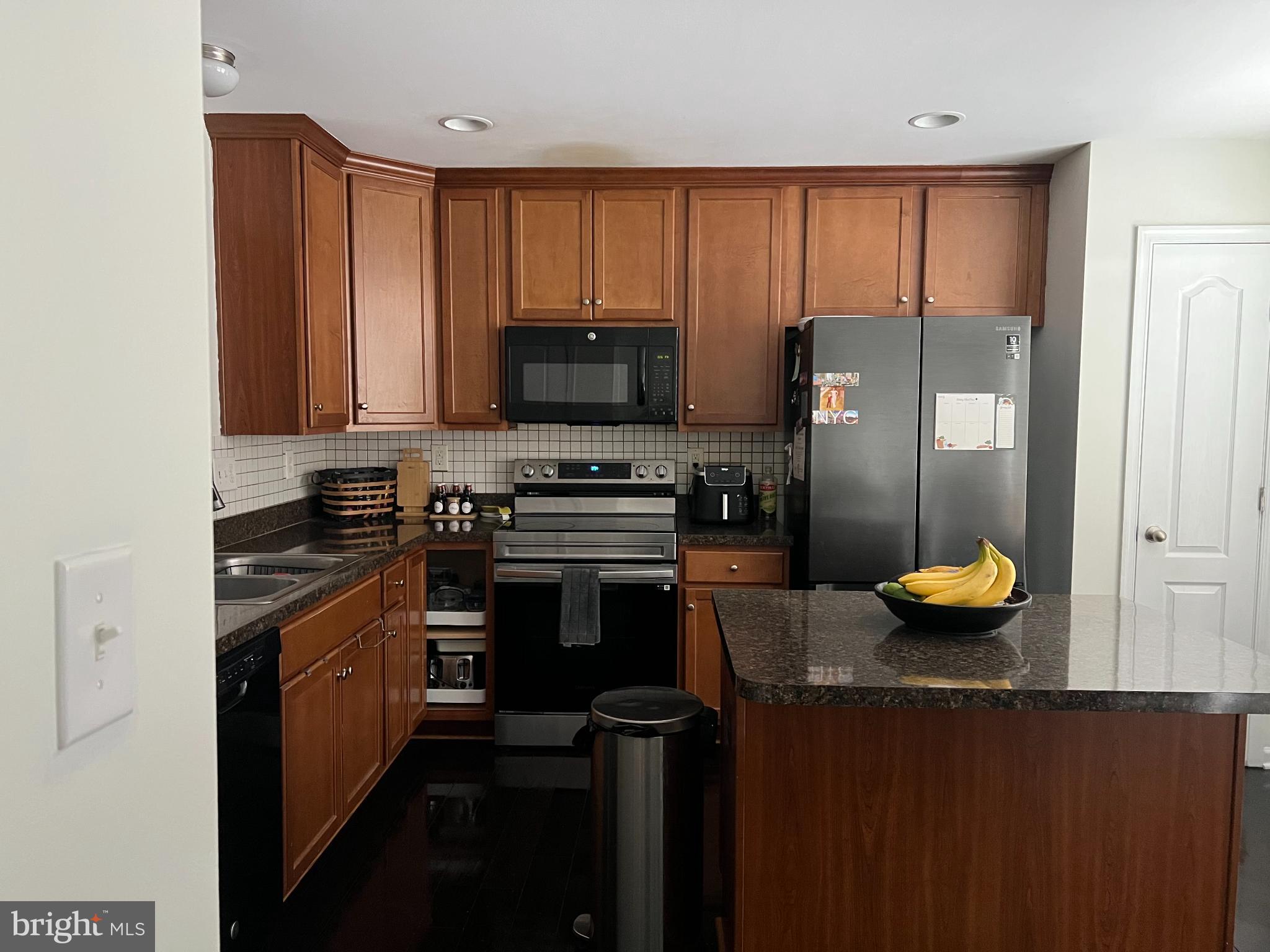1132 Stallion Street Ranson, WV 25438 - Photo 4 of 13 Modern kitchen with rich wood cabinetry.