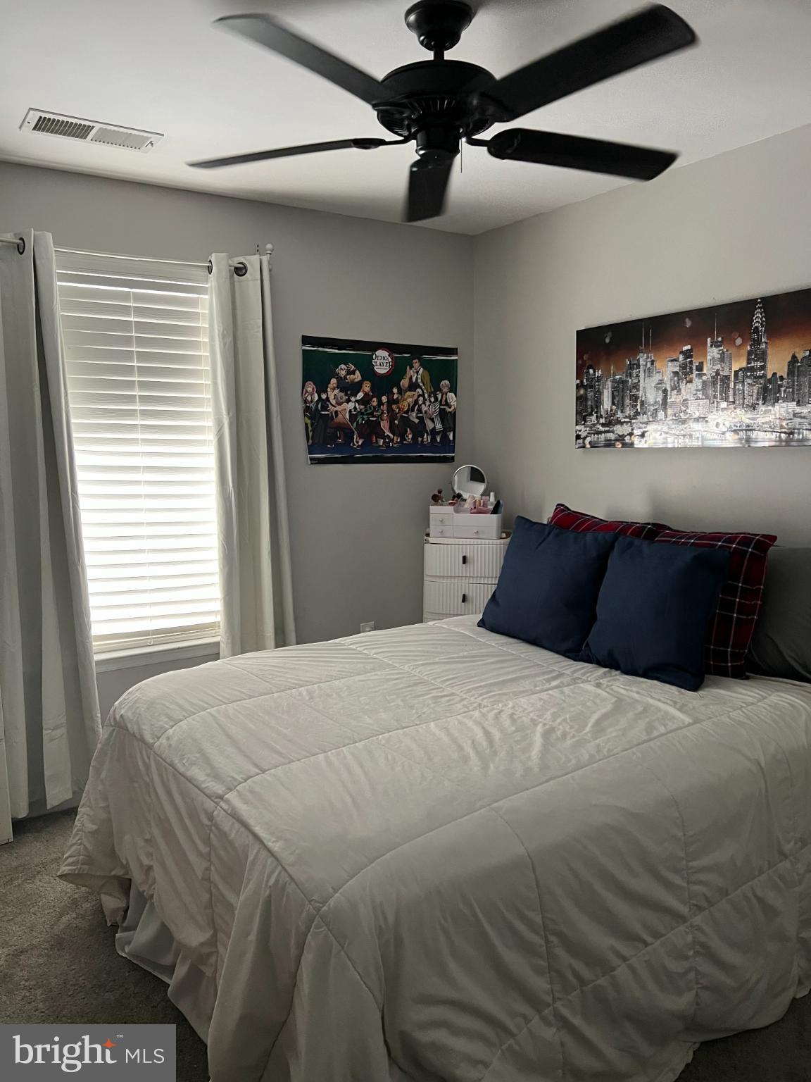 1132 Stallion Street Ranson, WV 25438 - Photo 10 of 13 Cozy bedroom with modern decor and light.