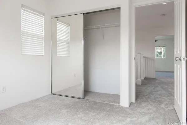 a view of a room with a hallway
