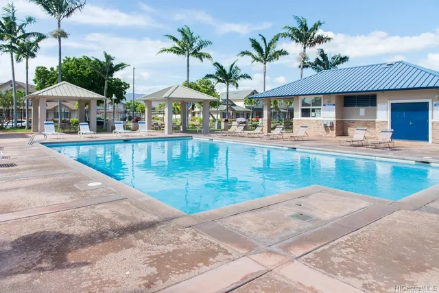 a view of patio with swimming pool table and chairs