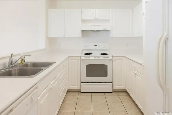 a utility room with sink dryer and washer