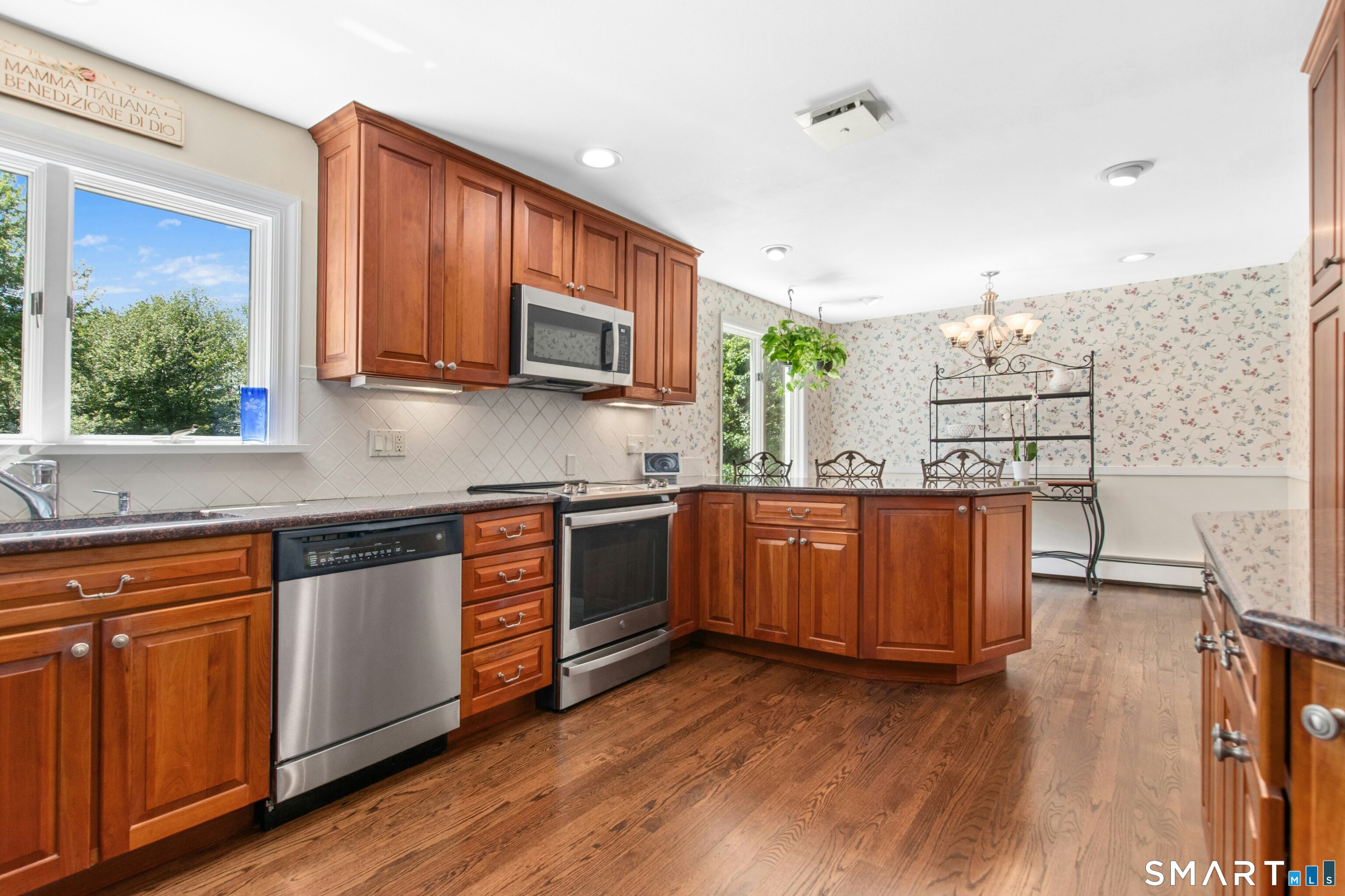 47 Pine Ridge Road Wilton, CT 06897 - Photo 23 of 40 The Kitchen with stainless steal appliances, sunlit casual dining area and plenty of storage options is anchored by a social island.