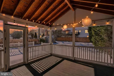 a view of a porch with wooden floor