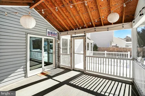 a view of balcony with wooden floor