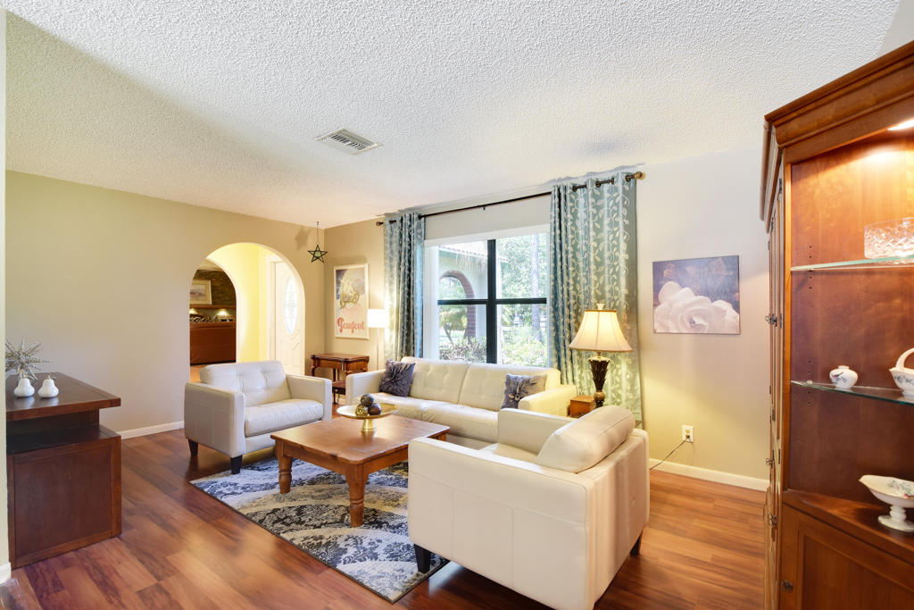 15429 Jupiter Farms Road Jupiter, FL 33478 - Photo 13 of 59 a living room with furniture and a large window