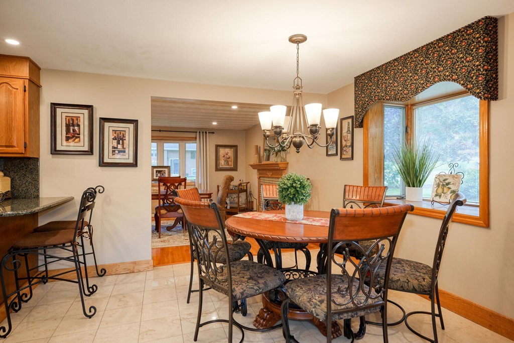 14 Princeton Road Burlington, MA 01803 - Photo 11 of 40 a view of a dining room and livingroom with furniture wooden floor a chandelier