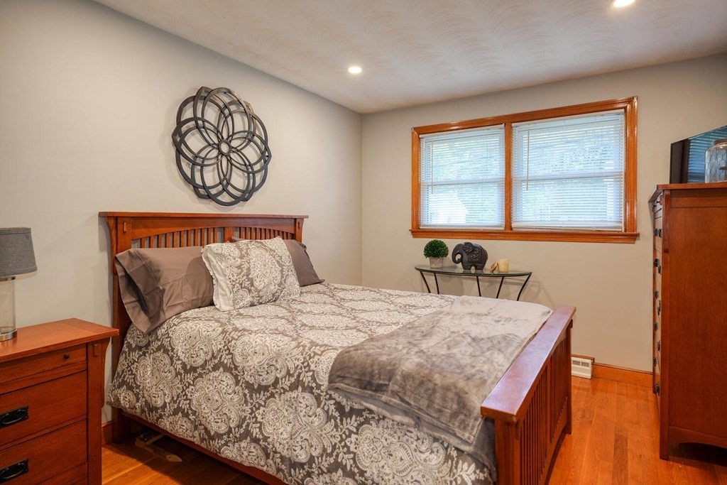 14 Princeton Road Burlington, MA 01803 - Photo 14 of 40 a bed sitting in a bedroom next to a window