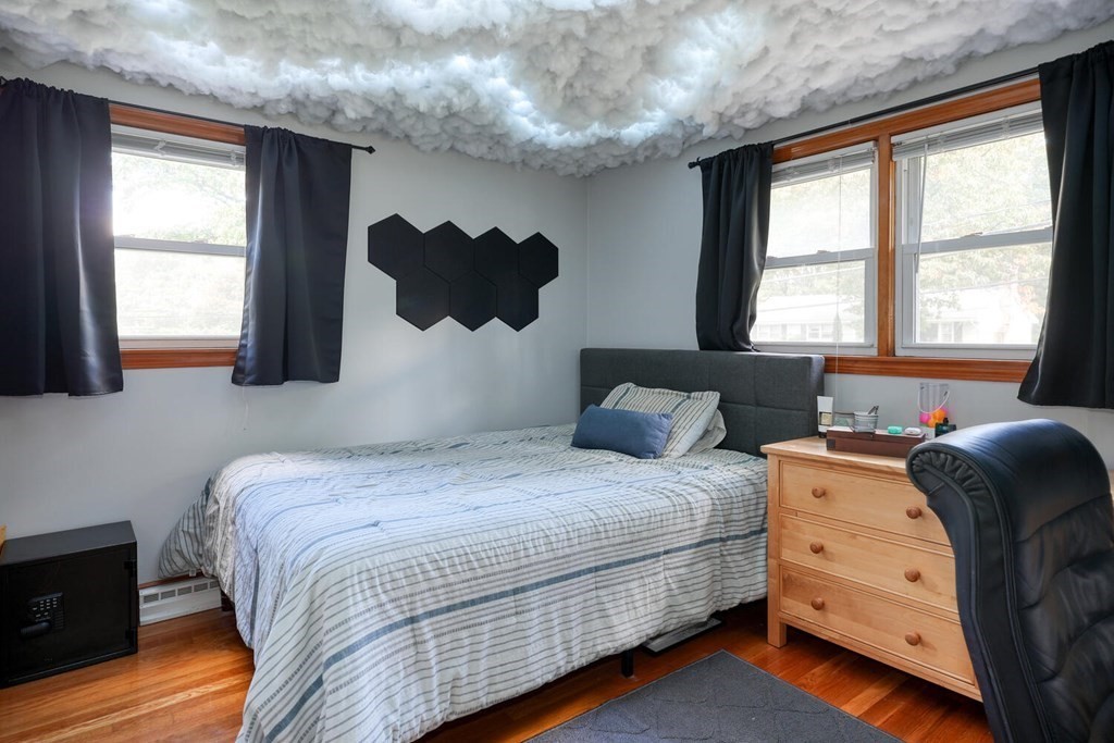 14 Princeton Road Burlington, MA 01803 - Photo 16 of 40 a bedroom with a bed and a dresser next to a window