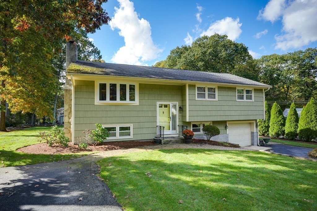 14 Princeton Road Burlington, MA 01803 - Photo 2 of 40 a front view of a house with a yard and garage