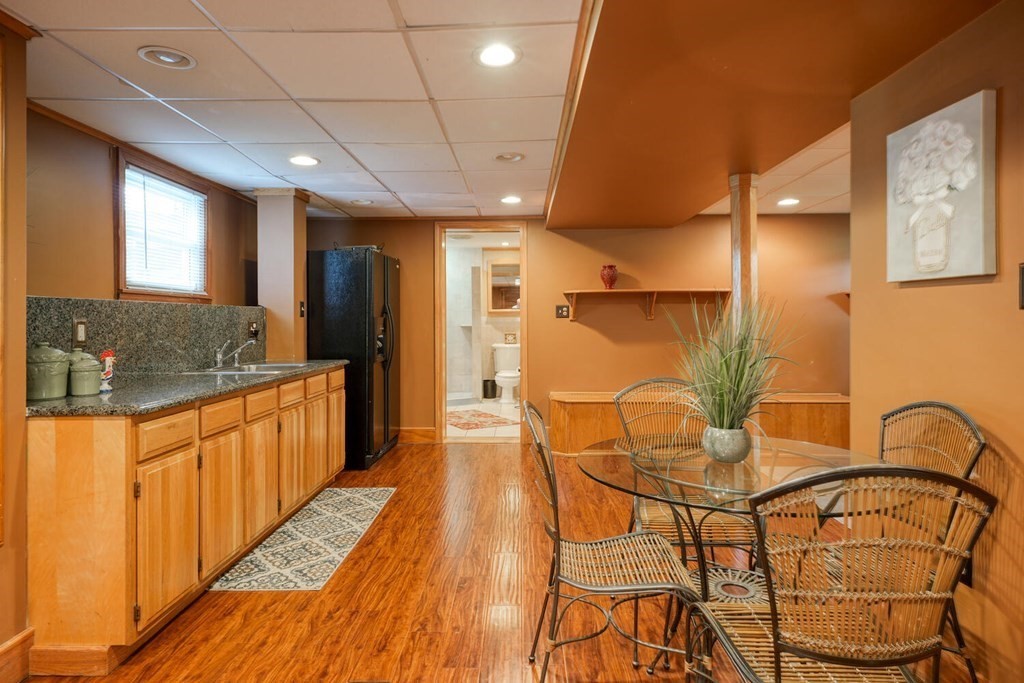 14 Princeton Road Burlington, MA 01803 - Photo 22 of 40 a open kitchen with stainless steel appliances granite countertop a sink a stove and a wooden floors