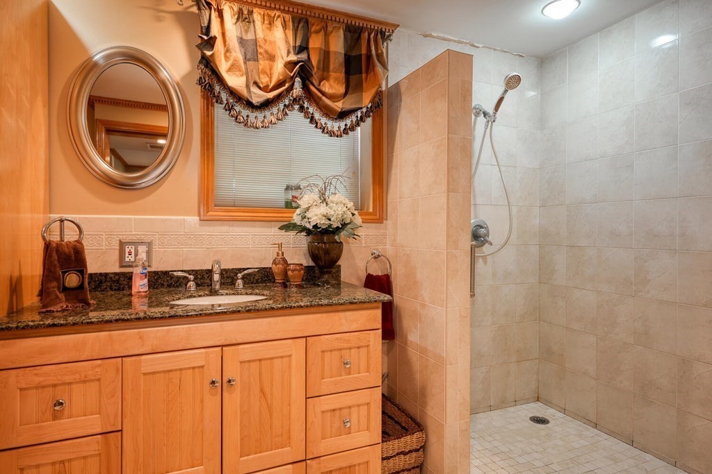 14 Princeton Road Burlington, MA 01803 - Photo 26 of 40 a bathroom with a sink and a mirror