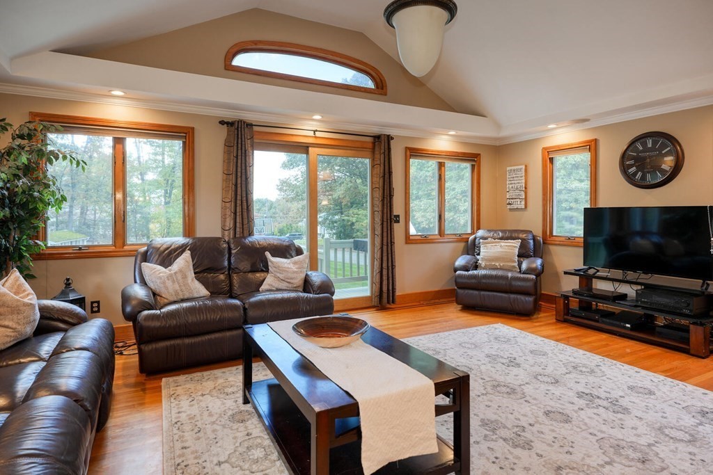 14 Princeton Road Burlington, MA 01803 - Photo 5 of 40 a living room with furniture a flat screen tv and a large window