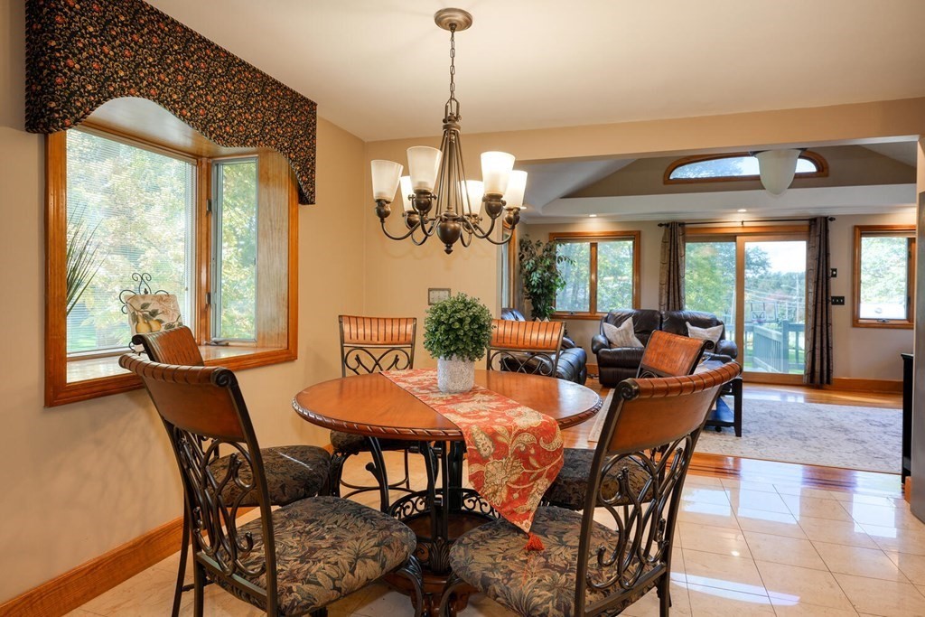 14 Princeton Road Burlington, MA 01803 - Photo 7 of 40 a dining room with furniture a chandelier and a rug
