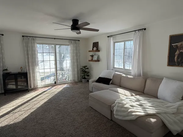 a bedroom with furniture and wooden floor