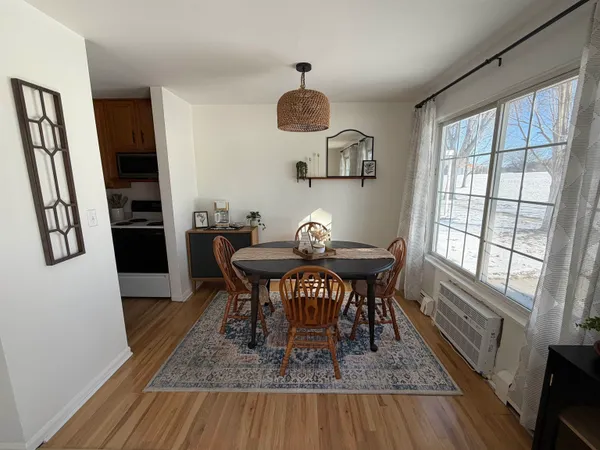 a kitchen with stainless steel appliances a sink dishwasher and cabinets with wooden floor