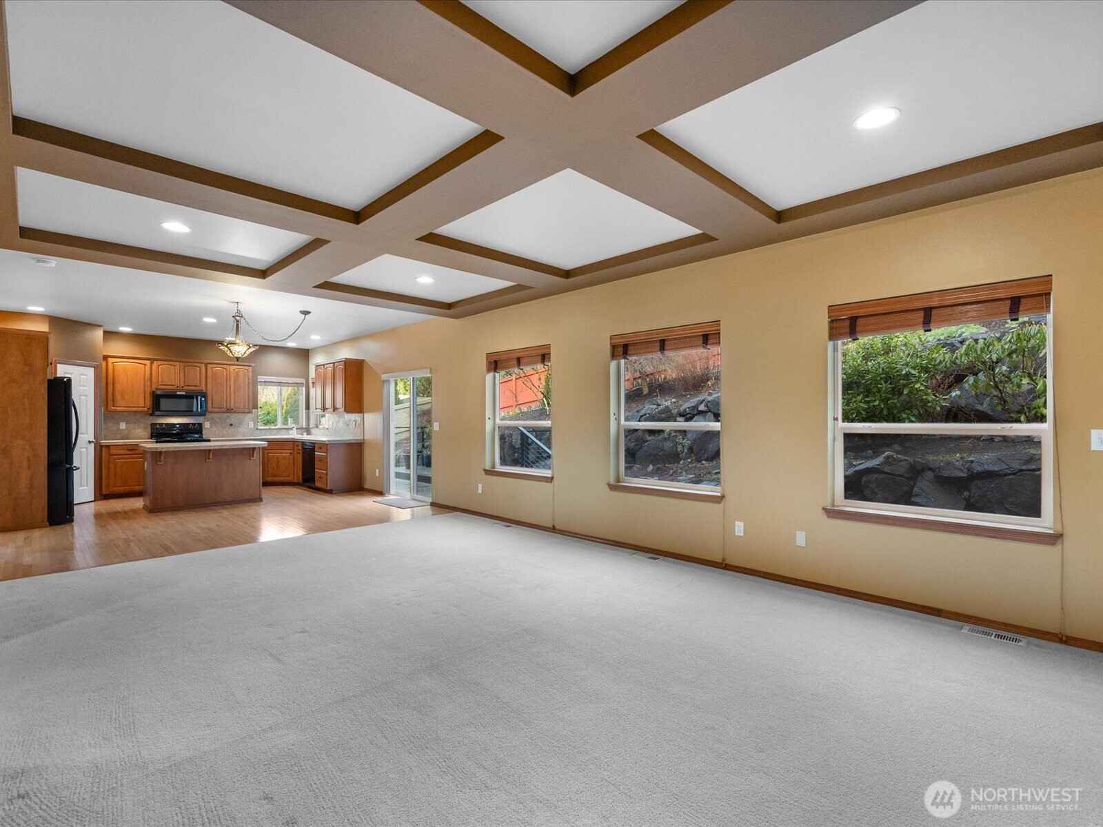 1824 23rd Street Snohomish, WA 98290 - Photo 13 of 38 a view of an empty room with a window and kitchen view
