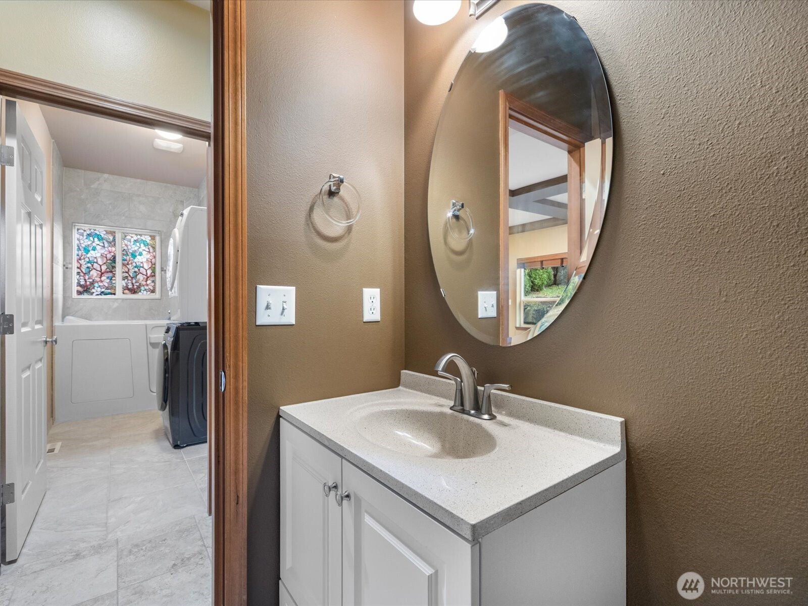 1824 23rd Street Snohomish, WA 98290 - Photo 21 of 38 a bathroom with a sink and a mirror