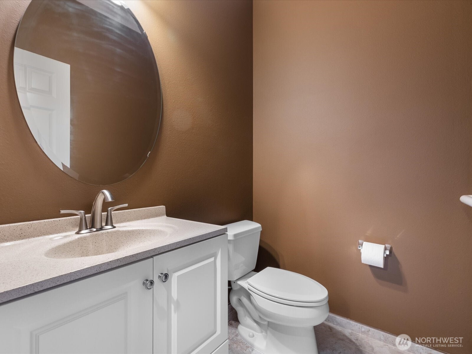 1824 23rd Street Snohomish, WA 98290 - Photo 22 of 38 a bathroom with a toilet a sink and mirror