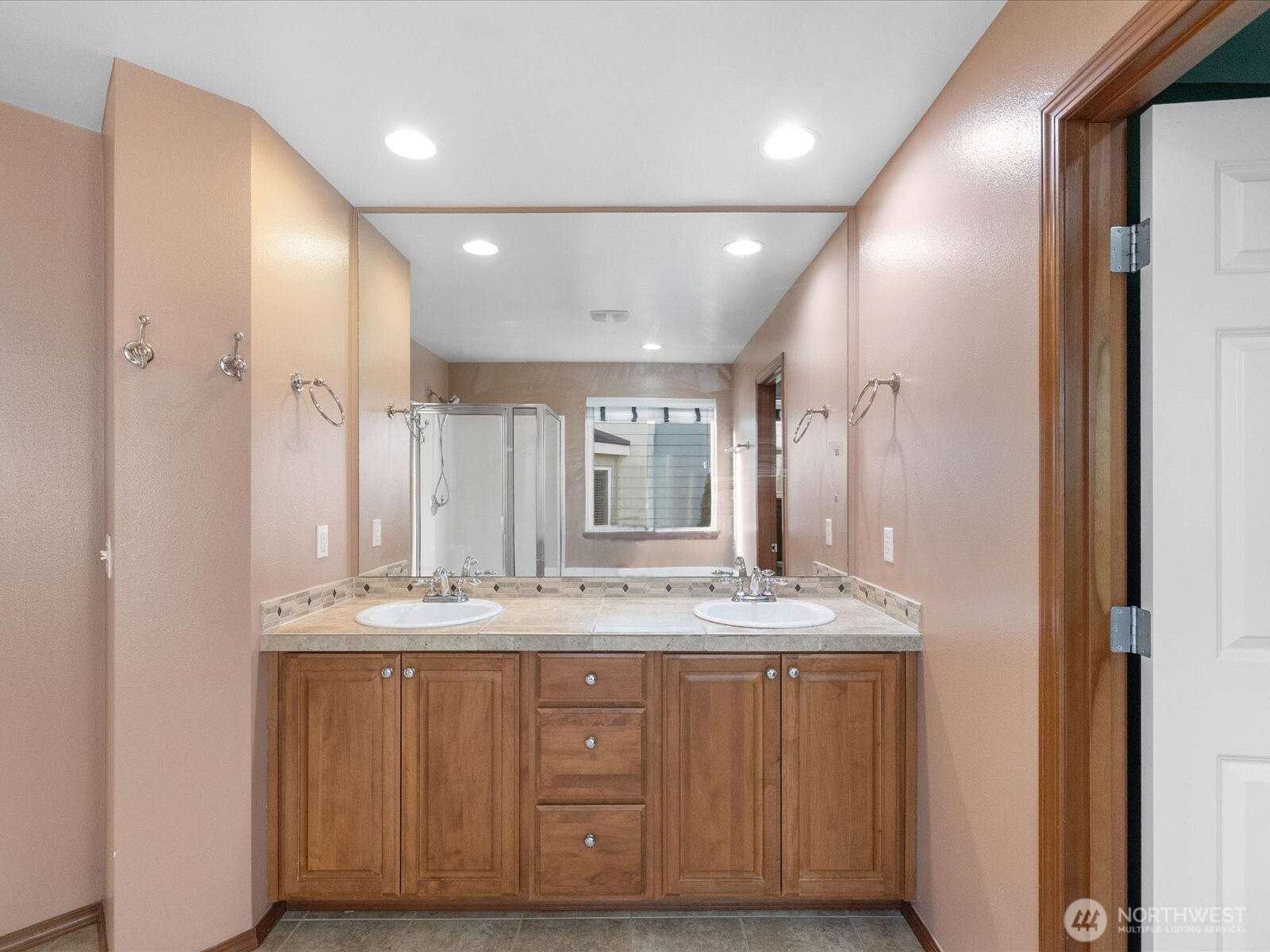 1824 23rd Street Snohomish, WA 98290 - Photo 30 of 38 a bathroom with a granite countertop sink a mirror and a shower