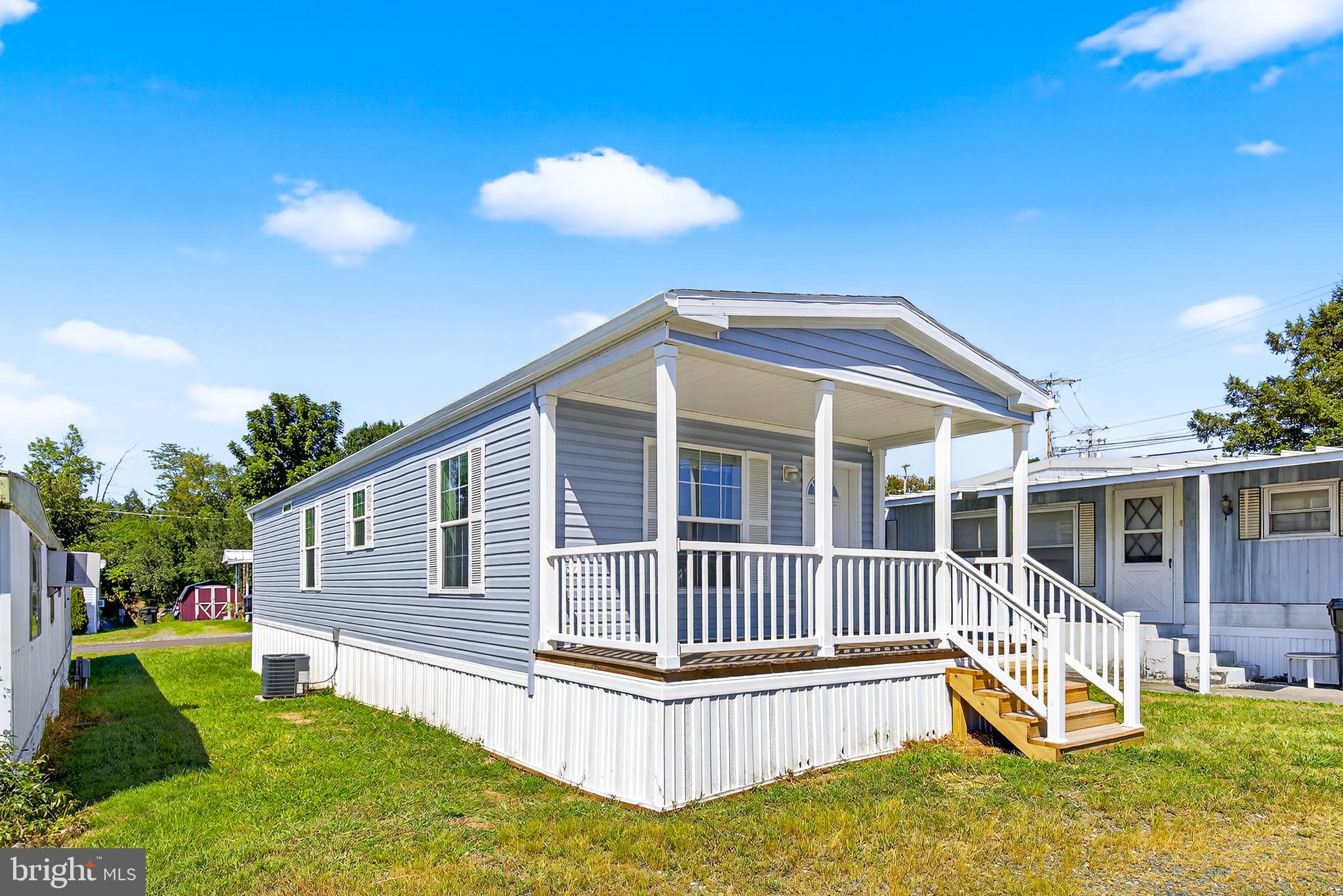 a view of a house with a backyard and a patio
