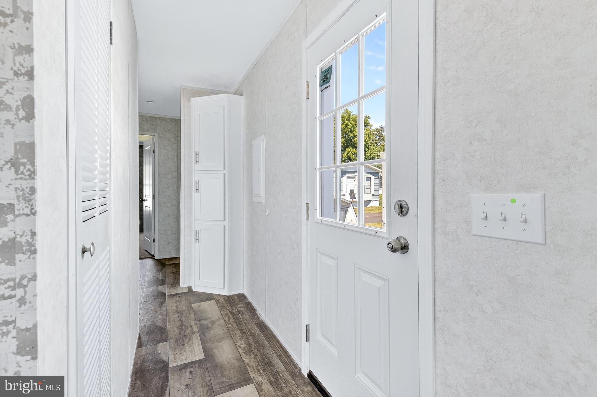 105 Bordic Road Reading, PA 19606 - Photo 13 of 26 a view of a hallway with wooden floor and windows