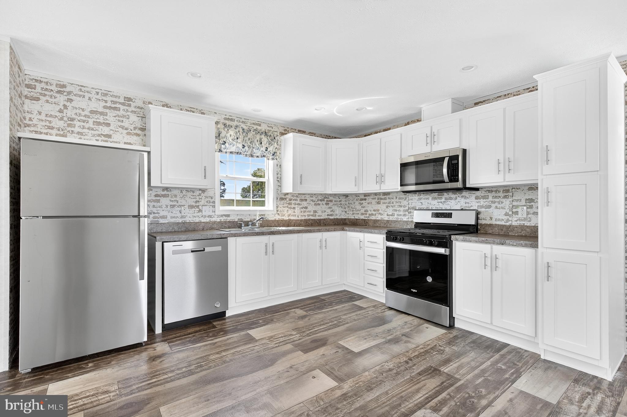 105 Bordic Road Reading, PA 19606 - Photo 15 of 26 a kitchen with granite countertop a refrigerator stove top oven and sink