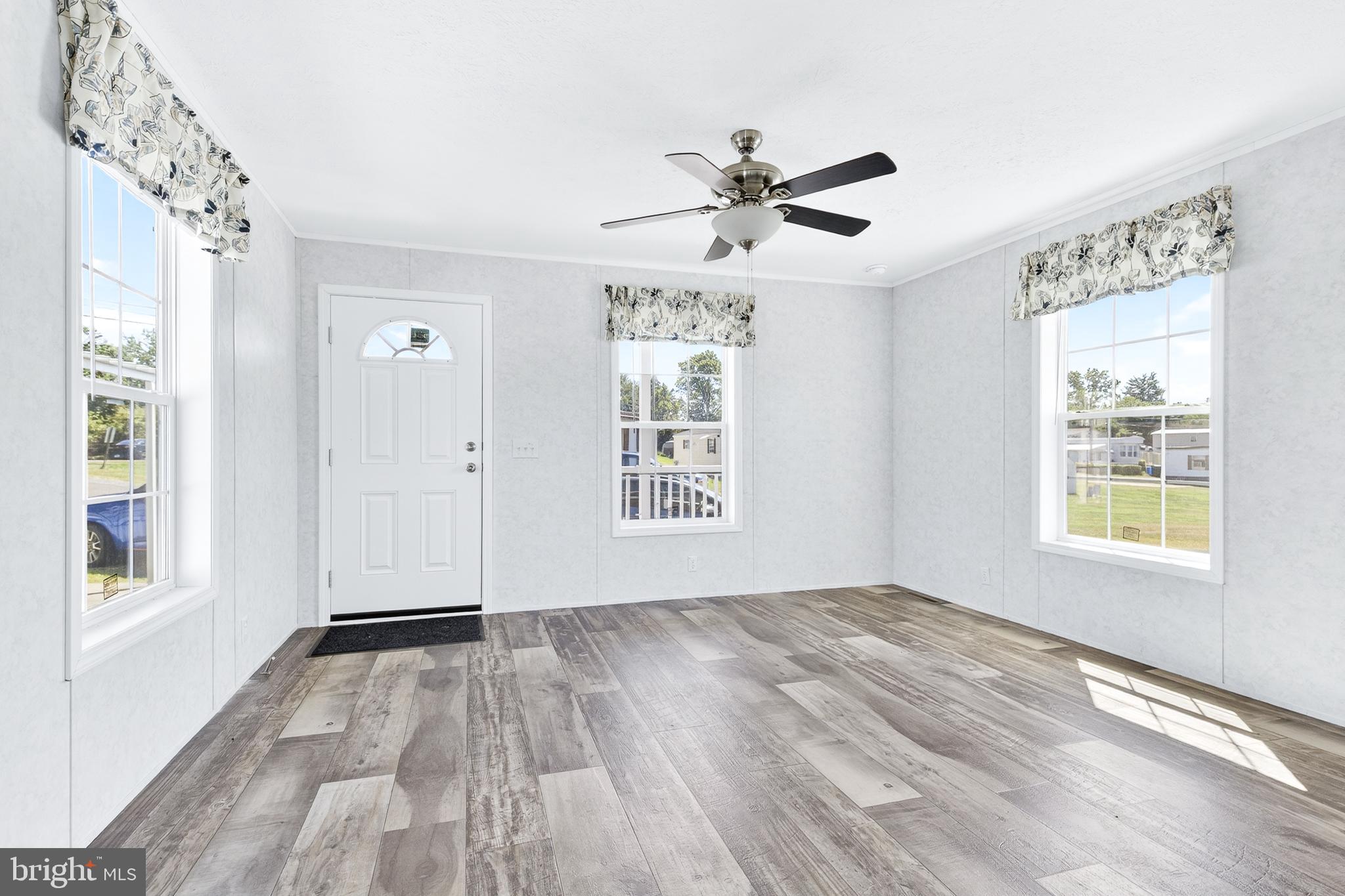 105 Bordic Road Reading, PA 19606 - Photo 17 of 26 a view of empty room with wooden floor and fan