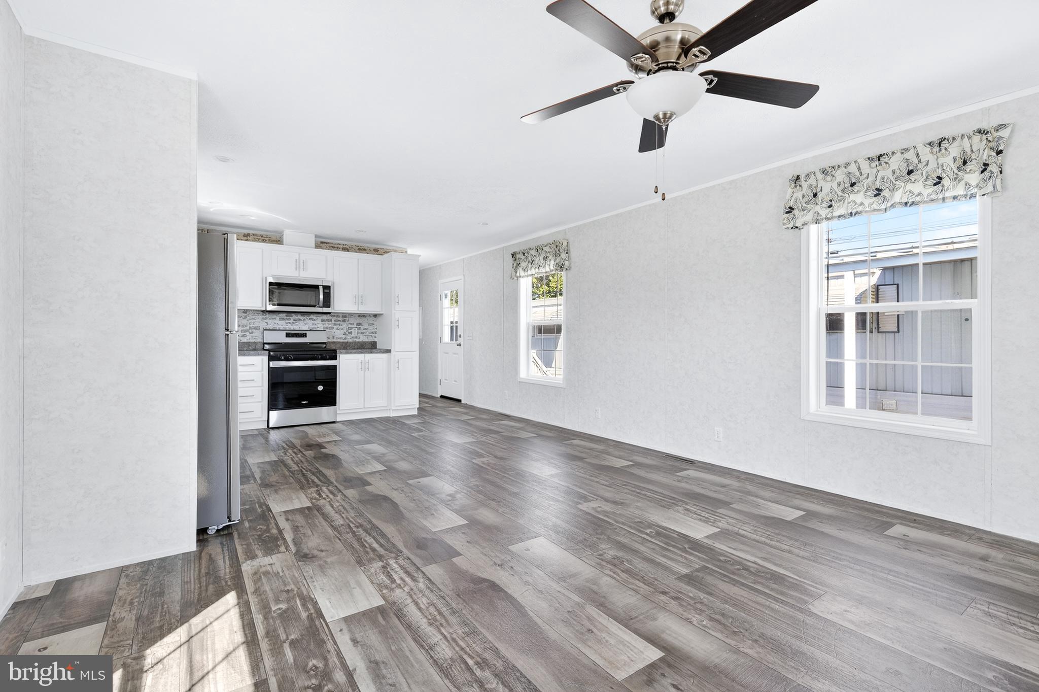 105 Bordic Road Reading, PA 19606 - Photo 18 of 26 a view of an empty room with a window and kitchen view