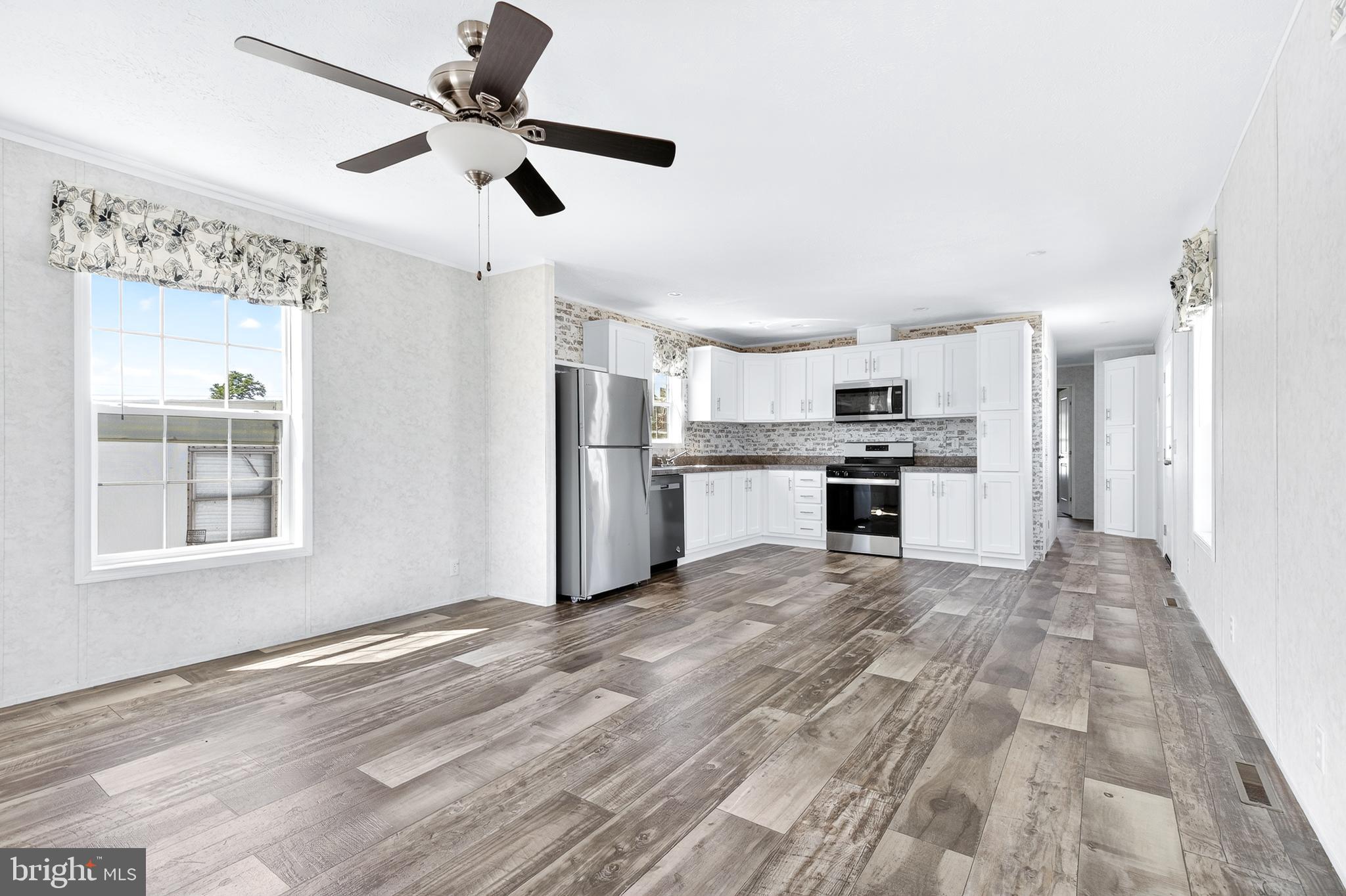 105 Bordic Road Reading, PA 19606 - Photo 19 of 26 a view of kitchen with stainless steel appliances kitchen island hardwood floor and a window