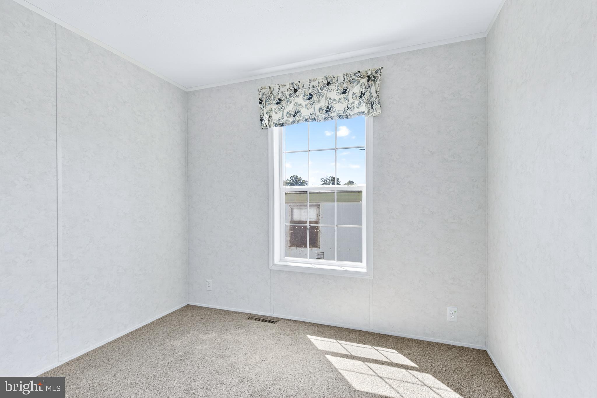 105 Bordic Road Reading, PA 19606 - Photo 6 of 26 a view of a big room with windows and cabinet