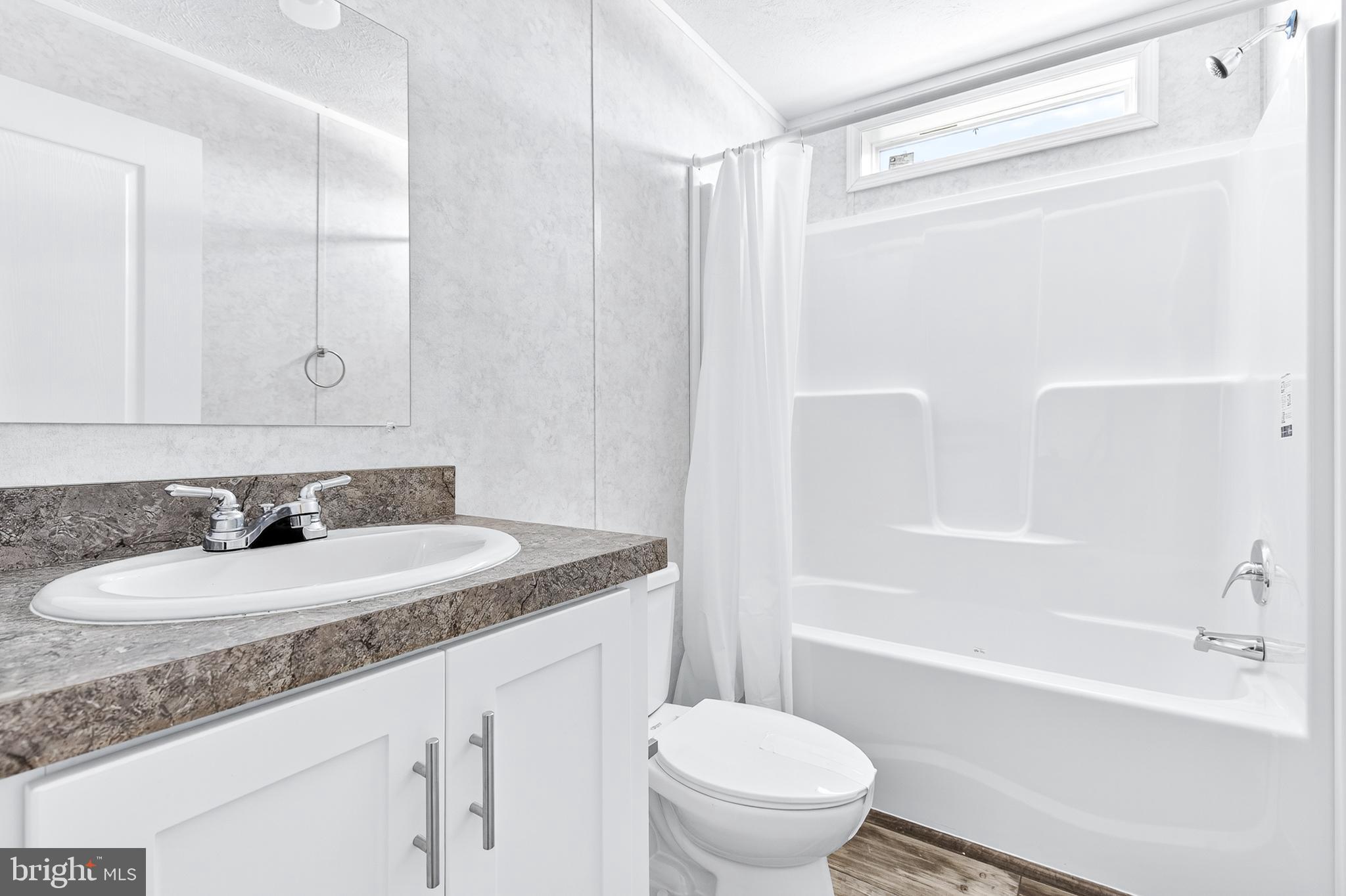 105 Bordic Road Reading, PA 19606 - Photo 8 of 26 a bathroom with a granite countertop sink toilet and shower
