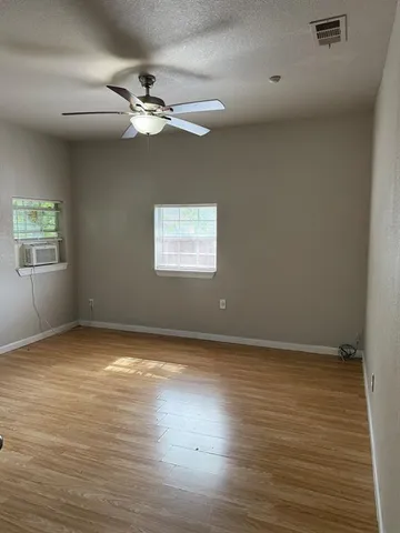 a view of an empty room with a window