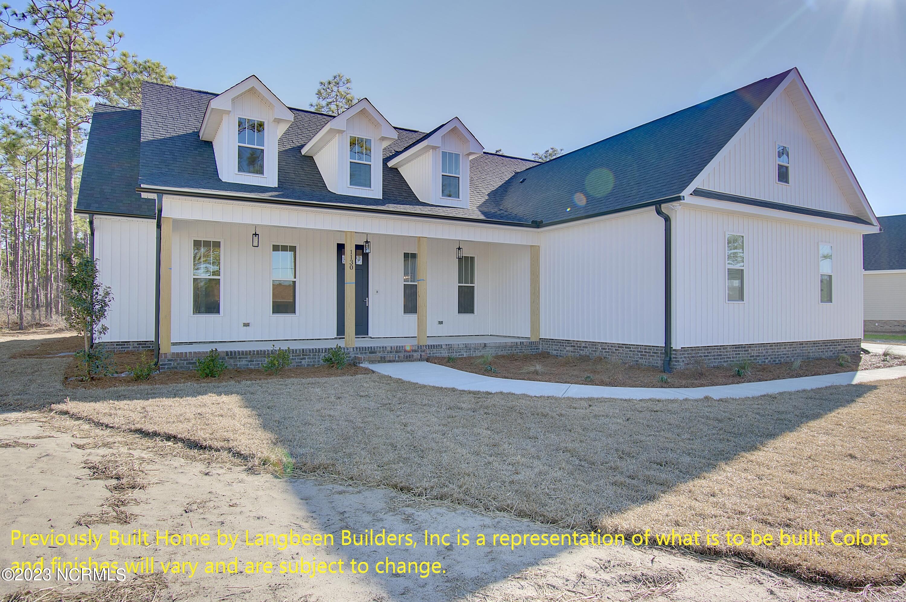 1032 Nicklaus Road Southport, NC 28461 - Photo 1 of 23 Previously Built Home by Langbeen Builders, Inc is a representation of what is to be built. Colors and finishes will vary and are subject to change.