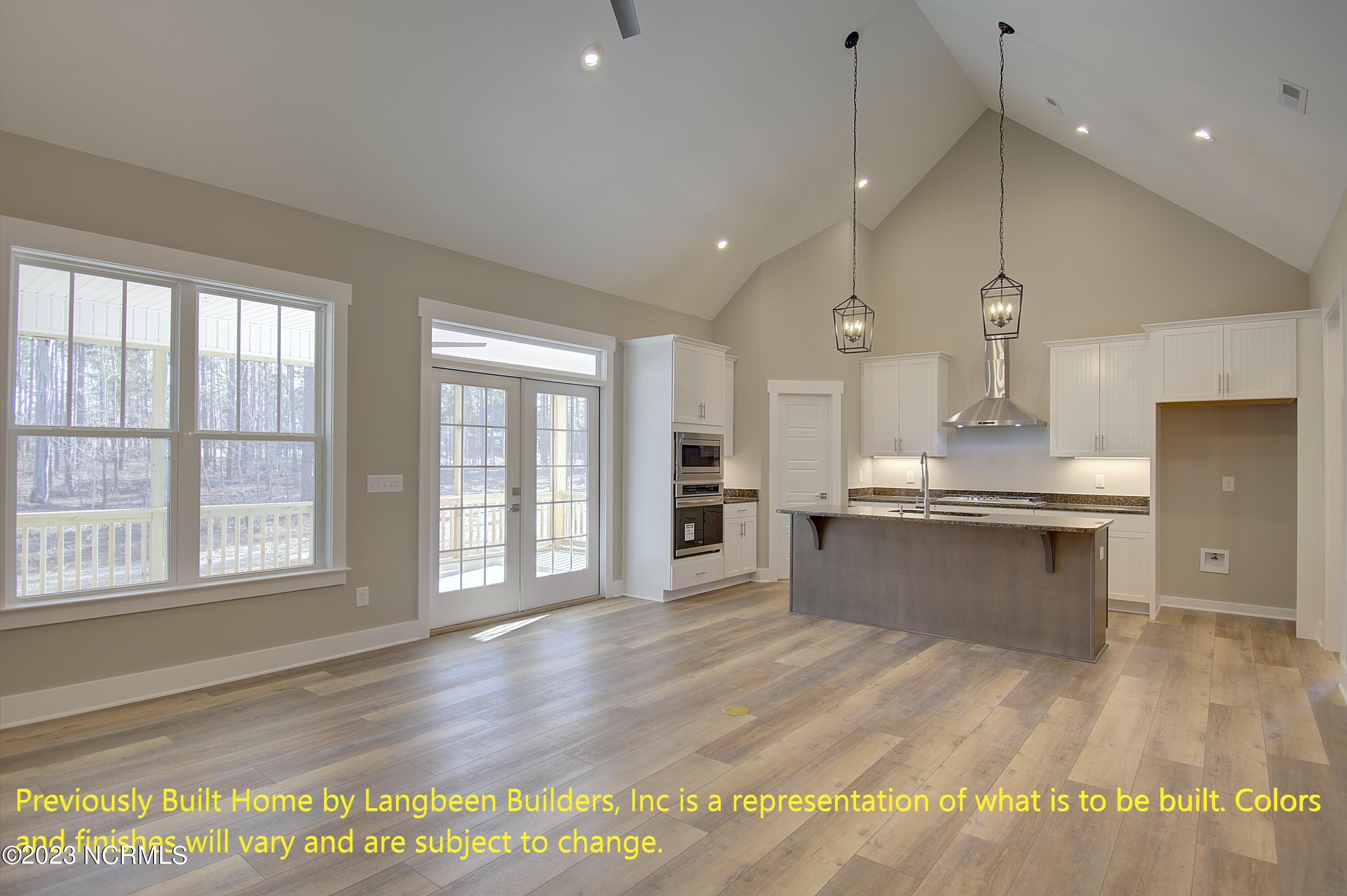 1032 Nicklaus Road Southport, NC 28461 - Photo 2 of 23 Previously Built Home by Langbeen Builders, Inc is a representation of what is to be built. Colors and finishes will vary and are subject to change.