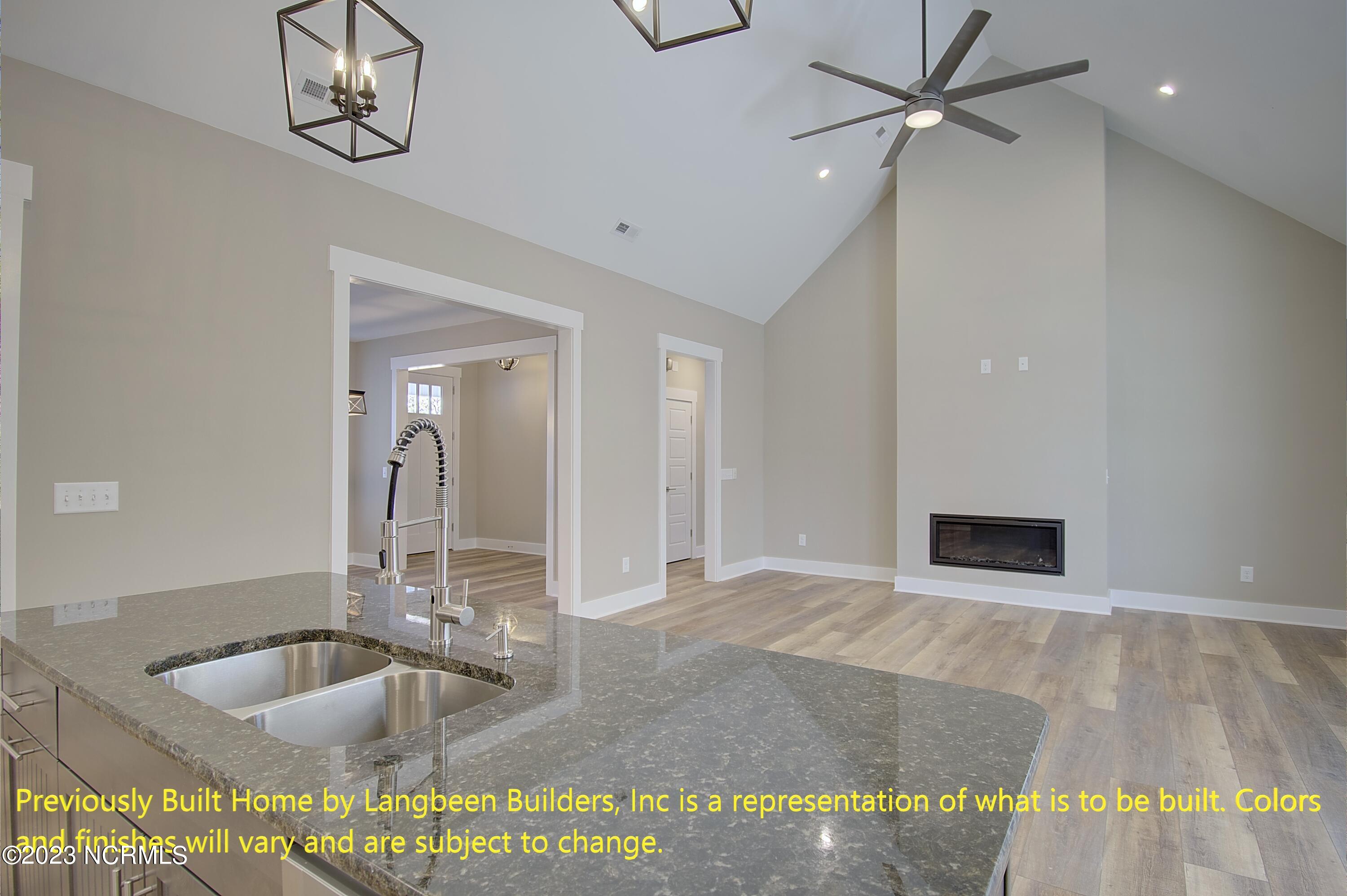 1032 Nicklaus Road Southport, NC 28461 - Photo 3 of 23 Previously Built Home by Langbeen Builders, Inc is a representation of what is to be built. Colors and finishes will vary and are subject to change.