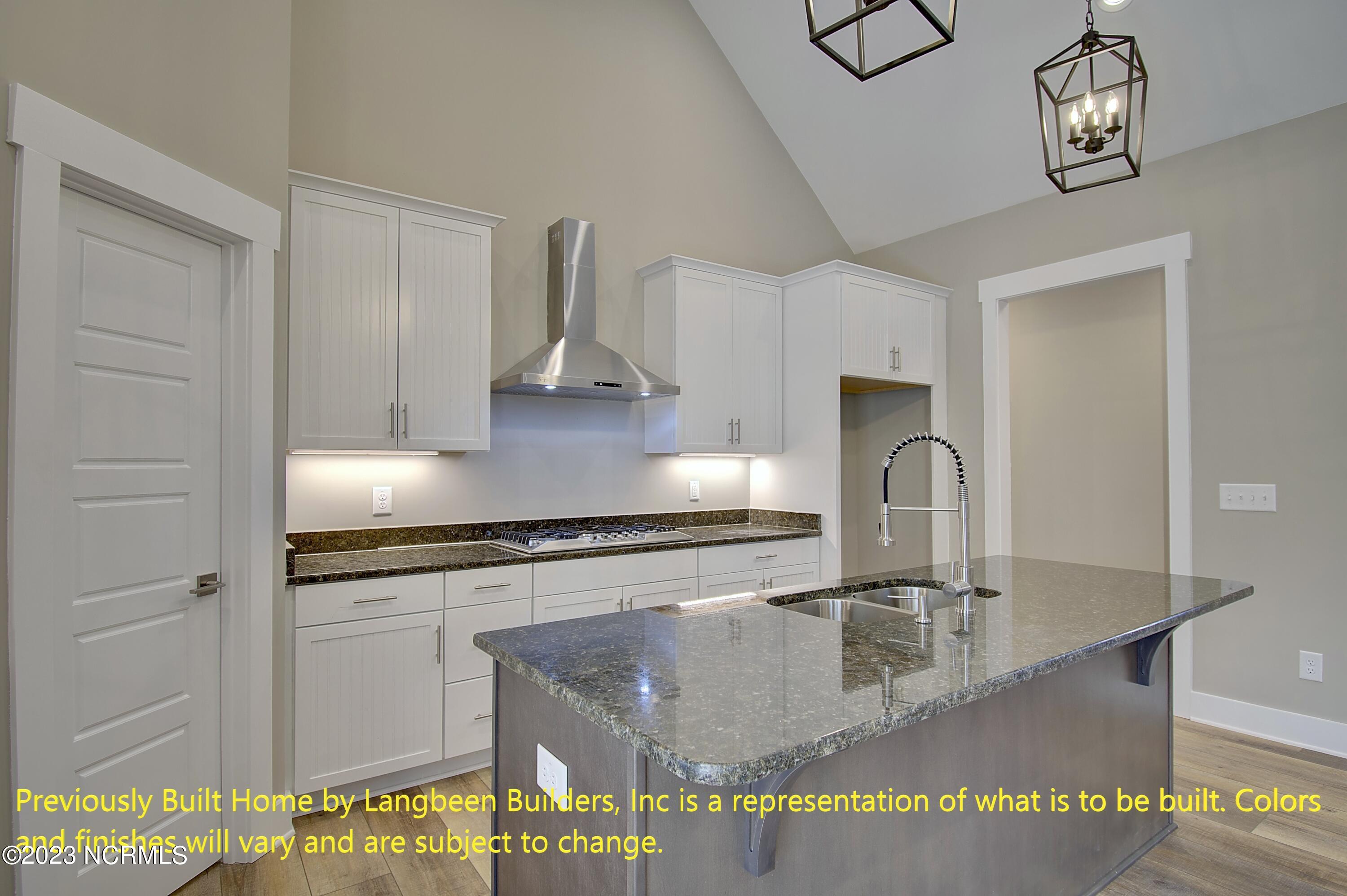 1032 Nicklaus Road Southport, NC 28461 - Photo 4 of 23 Previously Built Home by Langbeen Builders, Inc is a representation of what is to be built. Colors and finishes will vary and are subject to change.